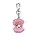 Pink and purple plush clam keychain with a smiling face on a white background