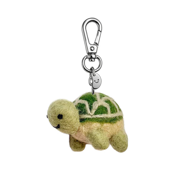 Plush turtle keychain with a carabiner on a white background