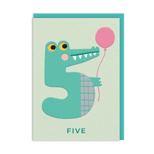 Card with a crocodile design holding a pink balloon and the number '5' on a light green background.