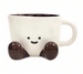 White mug with a cartoon face and chocolate pieces on a white background