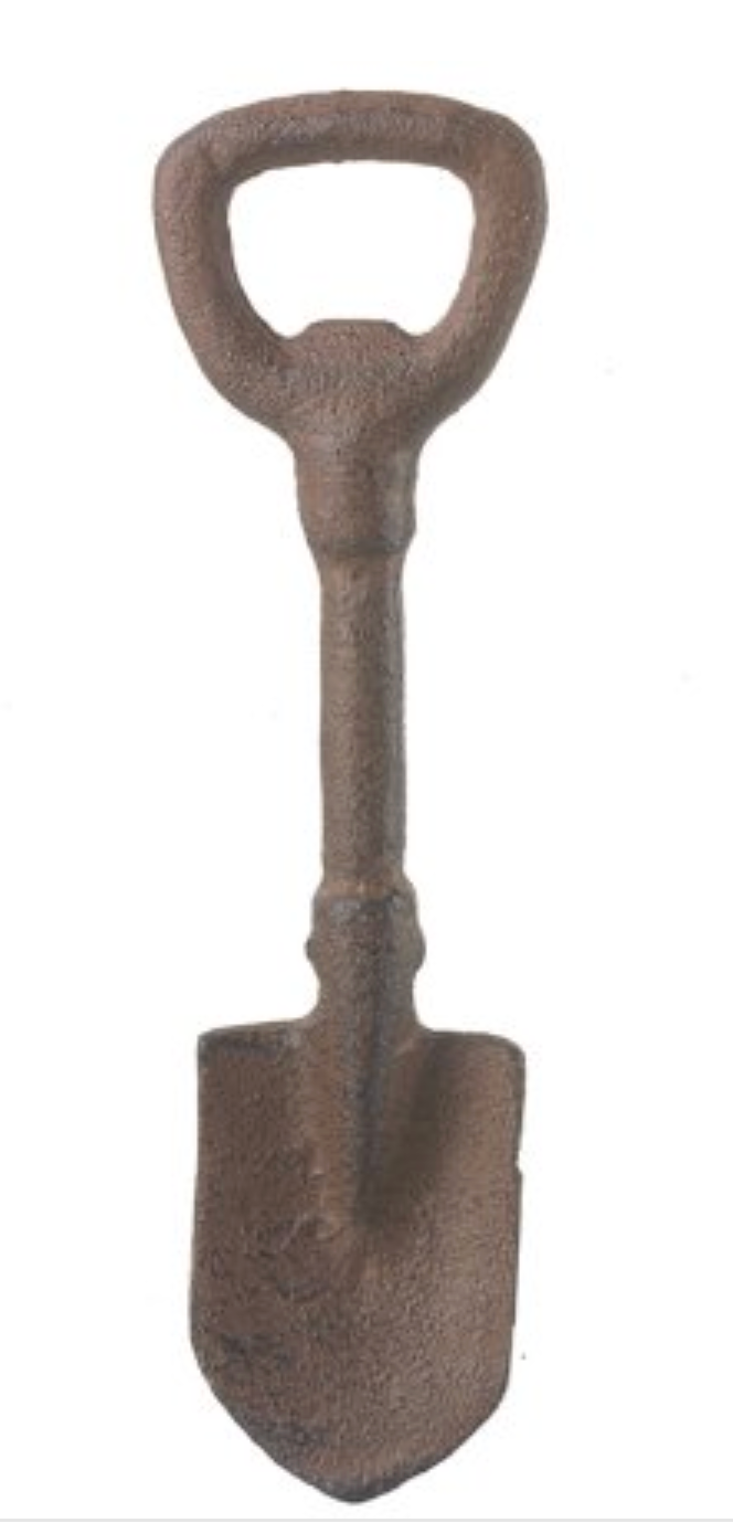 Brown cast iron shovel bottle opener  on a white background