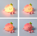 Four Night Light Toys resembling an peach with a smiling face on a grey background.