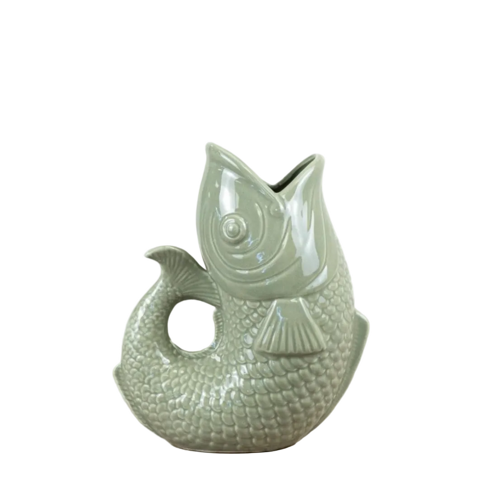 Green ceramic fish-shaped vase on a white background