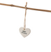 Heart-shaped ceramic tag with 'Best Friend' text hanging on a branch.