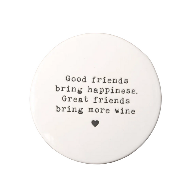 Round white coaster with black text on a white background