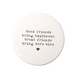 Round white coaster with black text on a white background