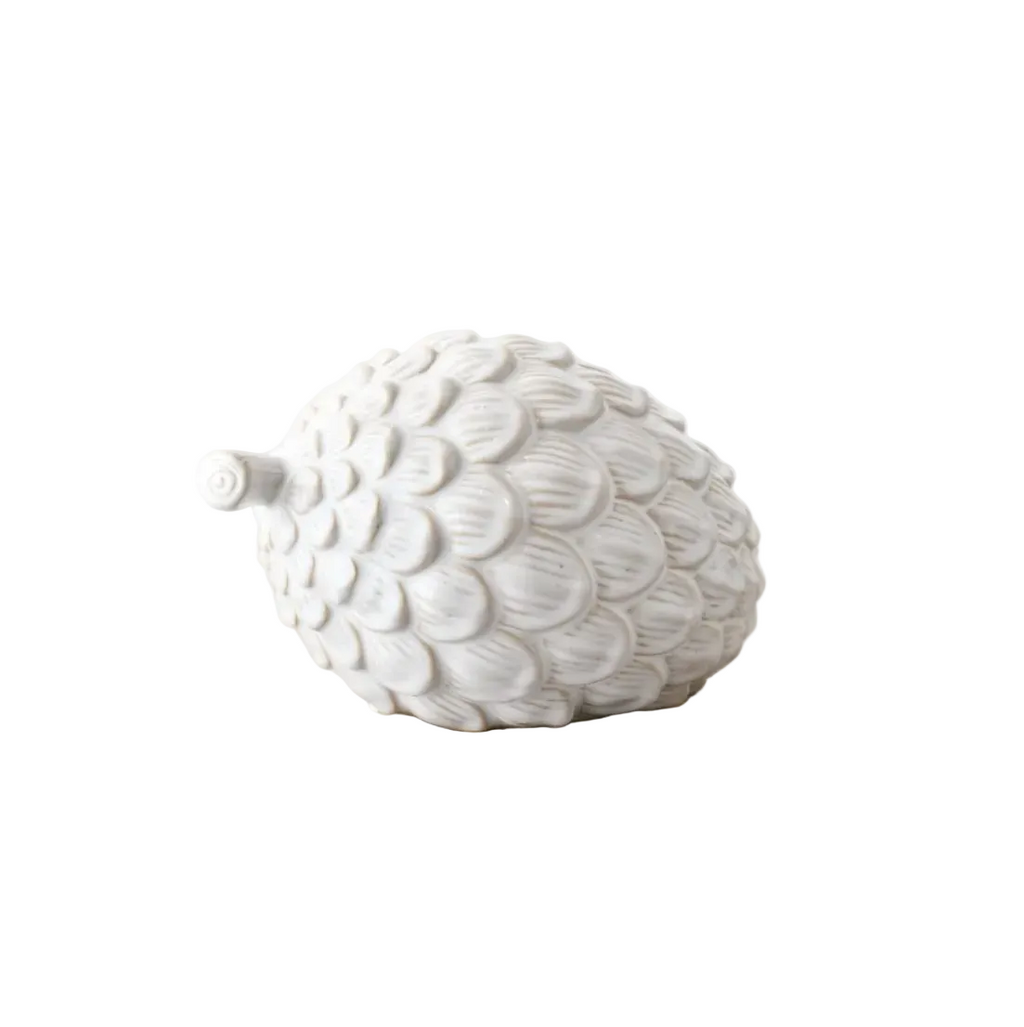 White textured decorative acorn on a white background