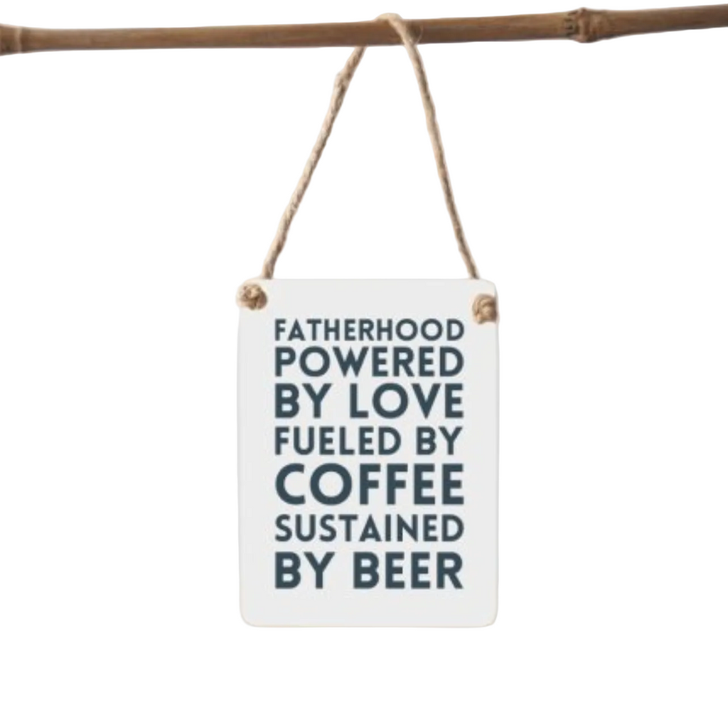 Small white sign with black text hanging on a branch against a white background