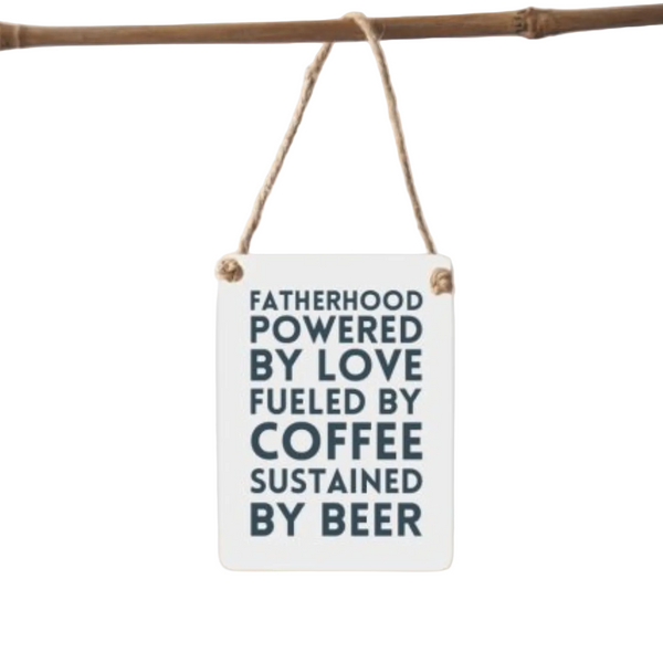 Small white sign with black text hanging on a branch against a white background