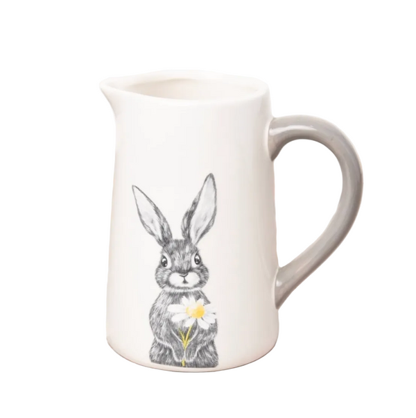 White ceramic mug with a rabbit illustration on a white background.