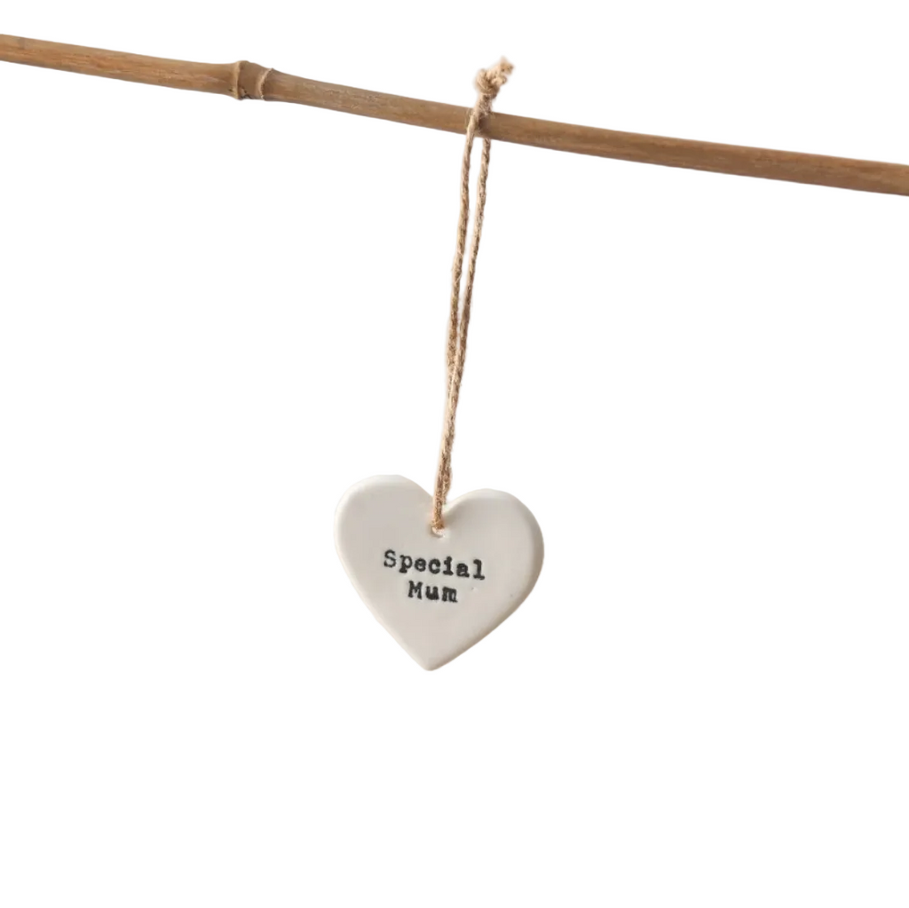 A dainty white porcelain heart featuring the sentiment "Special Mum" in a stamped typewriter-style font on a white background