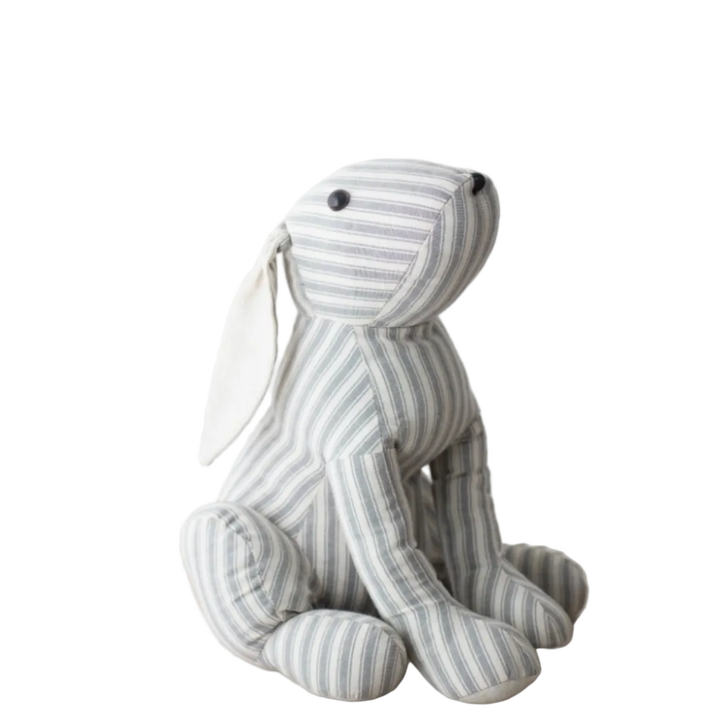 A sitting striped rabbit teddy with a white background