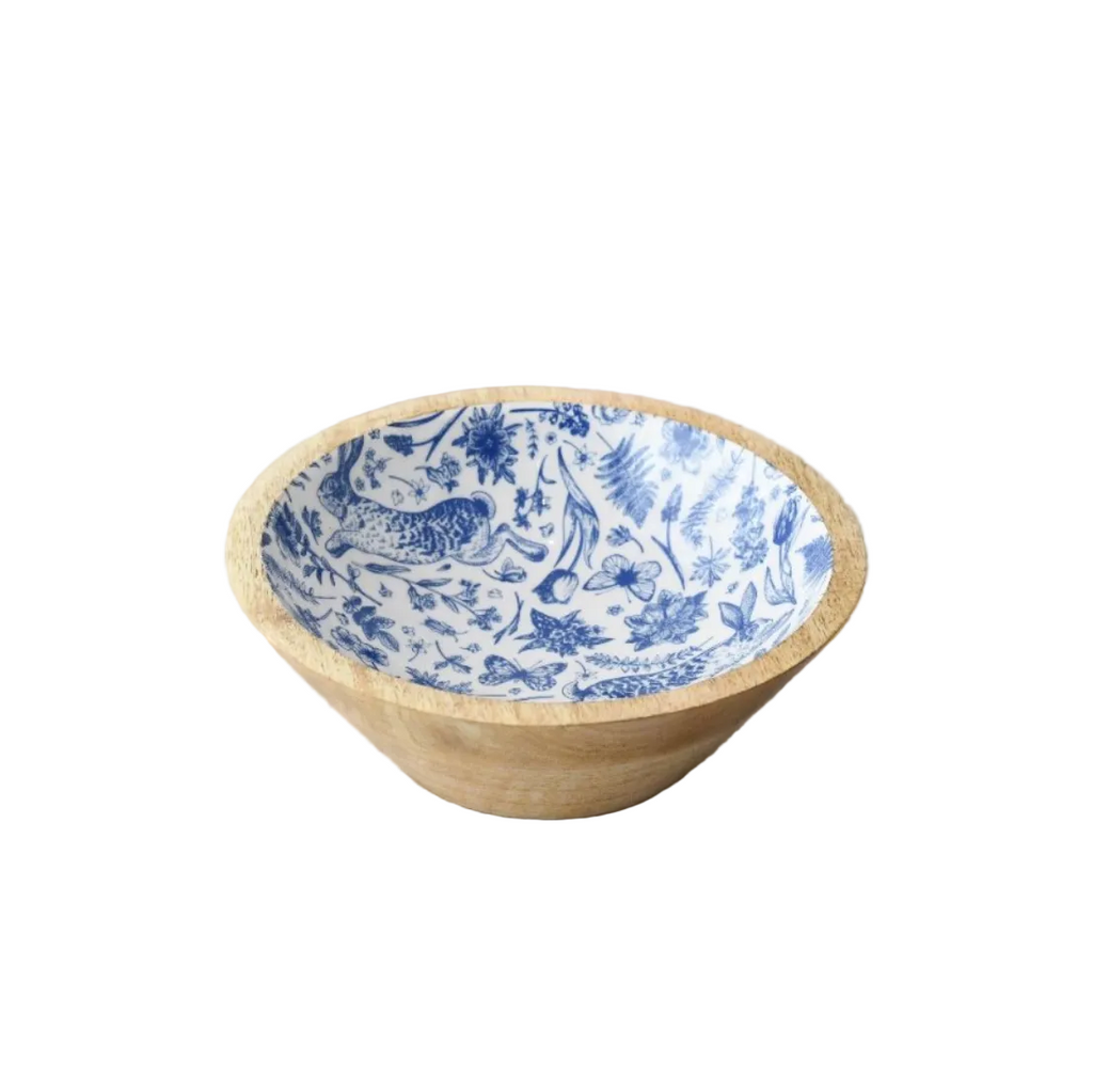 Bowl with blue floral pattern on a wooden surface