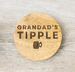 Wooden coaster with 'Grandad's Tipple' engraving on a white background