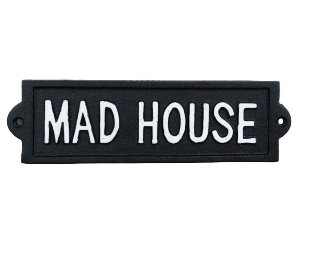 Cast iron decorative "Mad House" wall plaque on a white background.