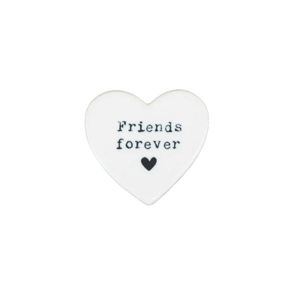Heart-shaped stone with 'Friends forever' text on a white background