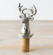 Decorative bottle stopper with deer head design on a neutral background