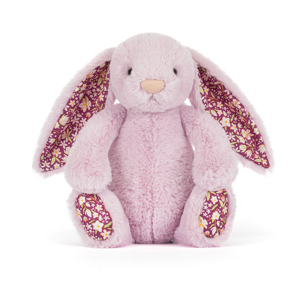 Plush bunny toy with floral ears and feet on a white background