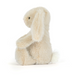 Plush toy resembling a rabbit with a white and gray pattern on a white background