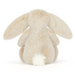 Fluffy white bunny toy on a white background