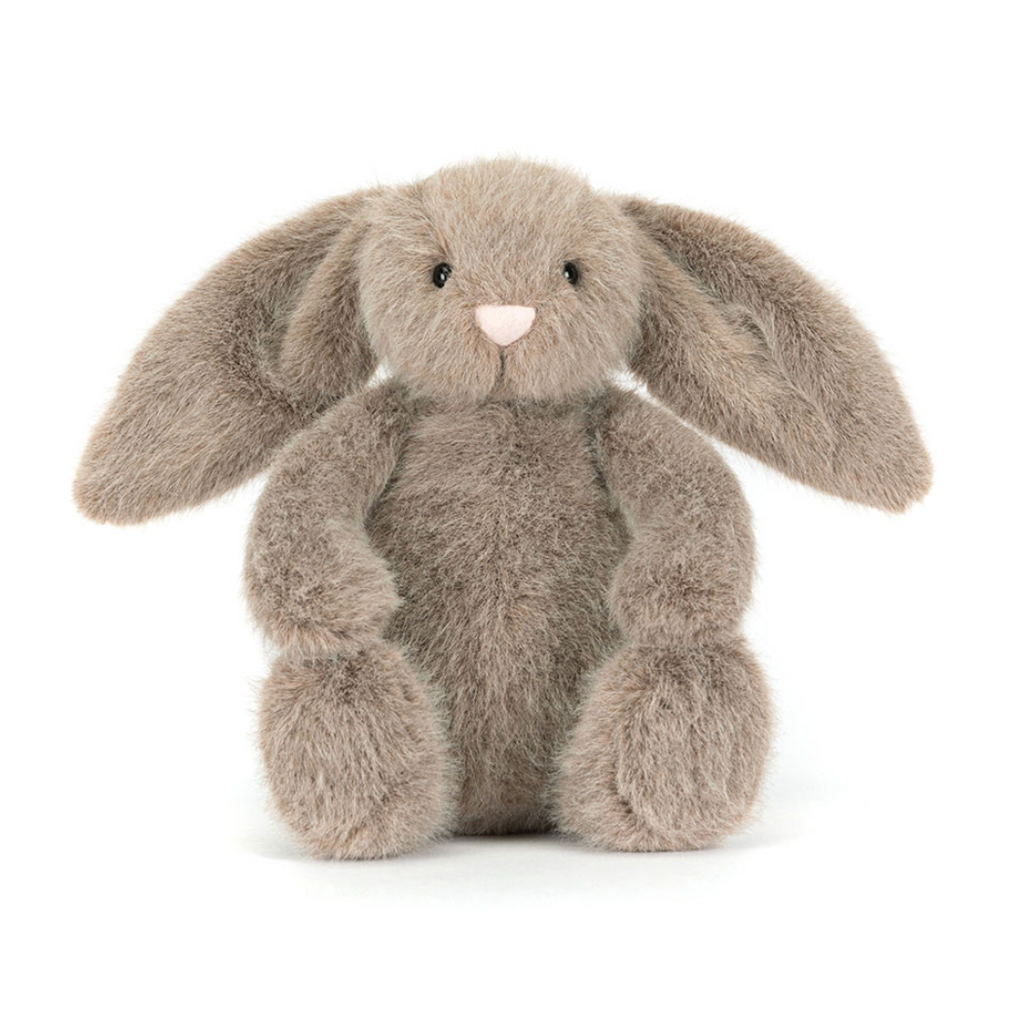 Plush grey bunny toy on a white background