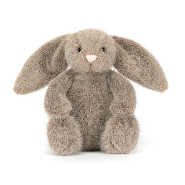Plush grey bunny toy on a white background
