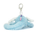 Plush blue creature keychain with a white strap on a white background