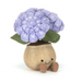 Stuffed toy with a purple flower and brown pot on a white background