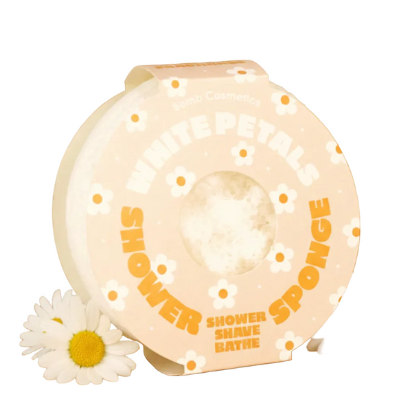 Shower sponge with floral design on a beige background