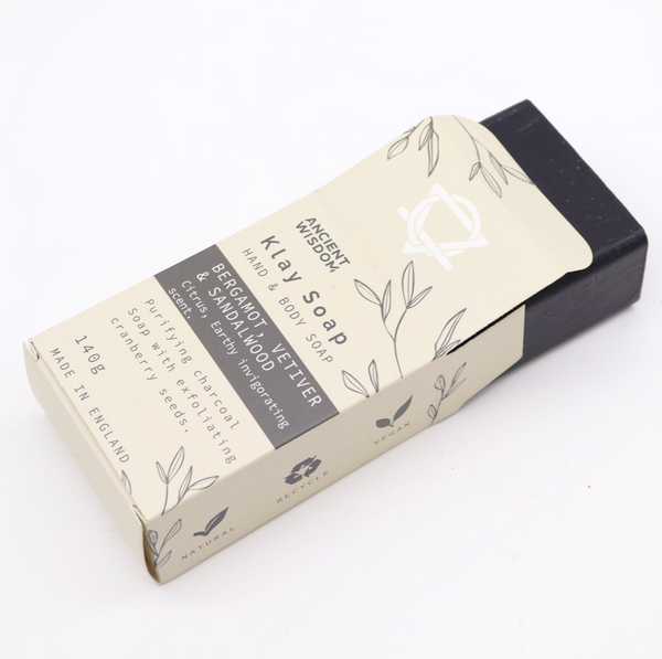 Bar of soap with a Klay Soap packaging on a white background