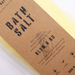 Bath salt bar with brown label on a white background