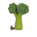 Toy broccoli with a green stem and brown roots on a white background