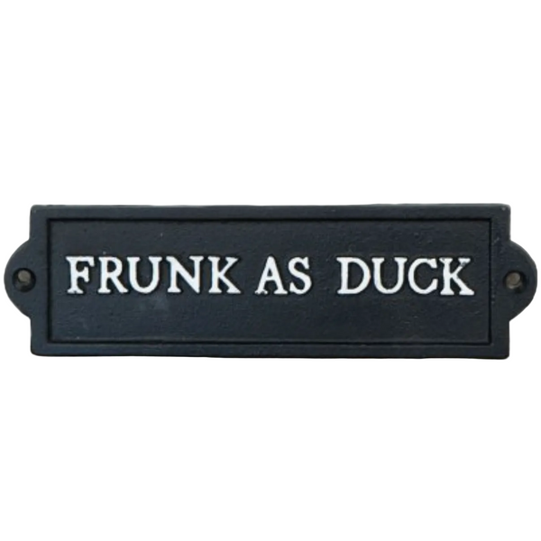 Black sign with 'FRUNK AS DUCK' text on a white surface