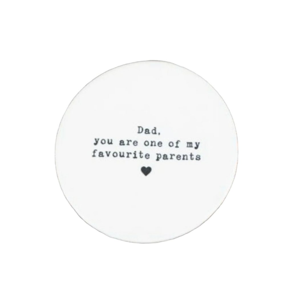 Round white card with text on a white surface