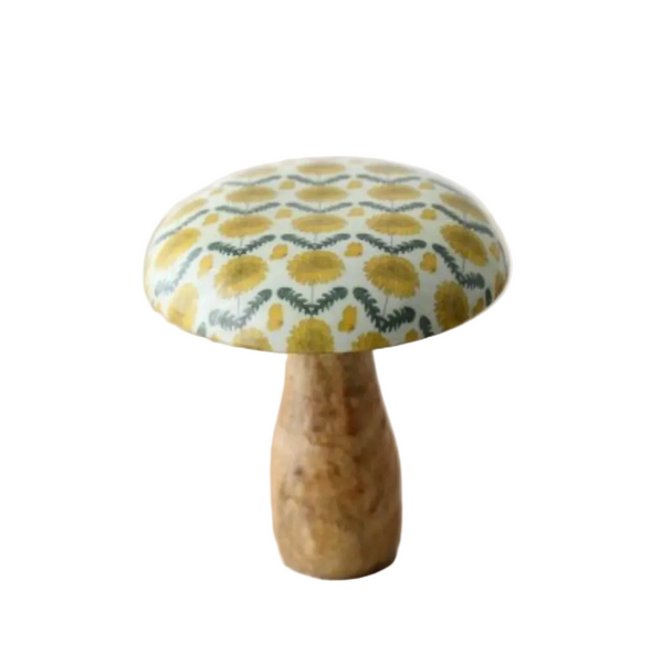 Decorative mushroom with a patterned cap on a white surface