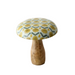 Decorative mushroom with a patterned cap on a white surface