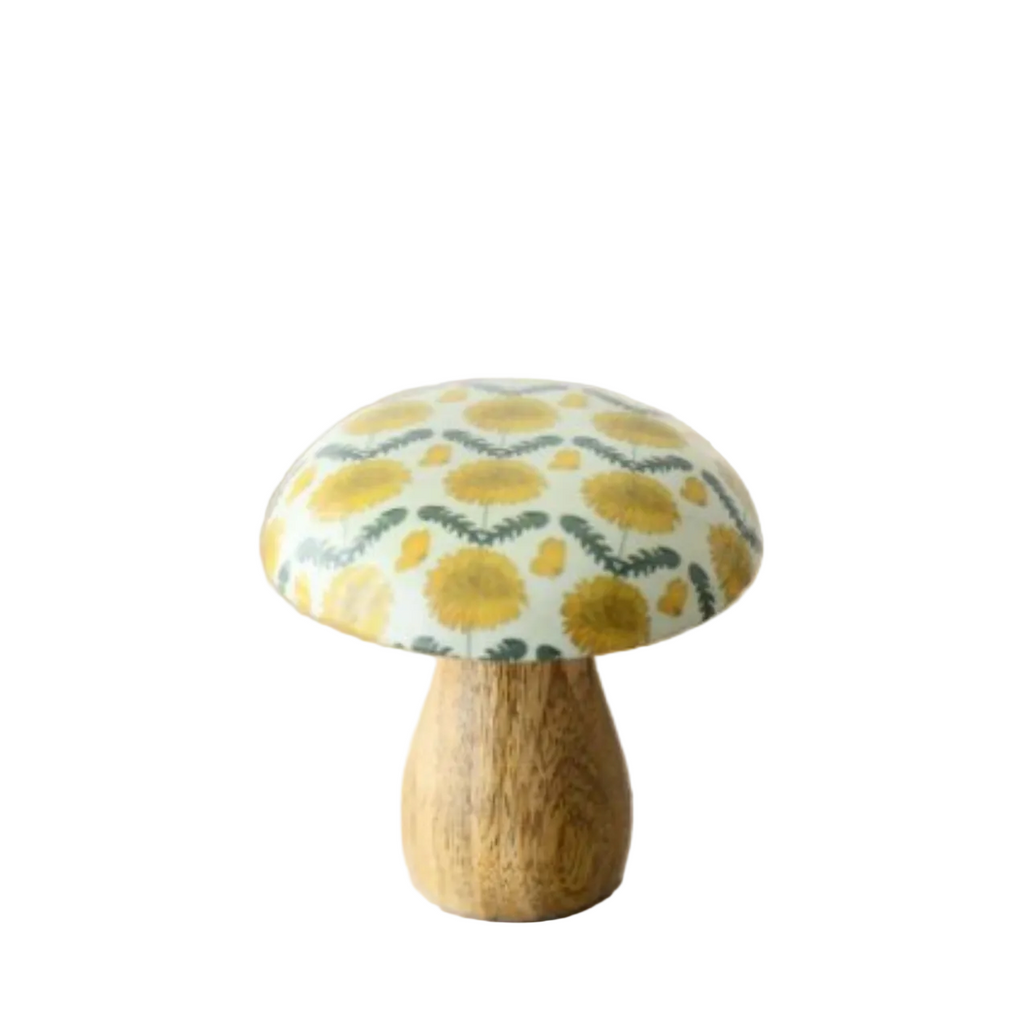 Decorative mushroom with a floral patterned cap on a white surface