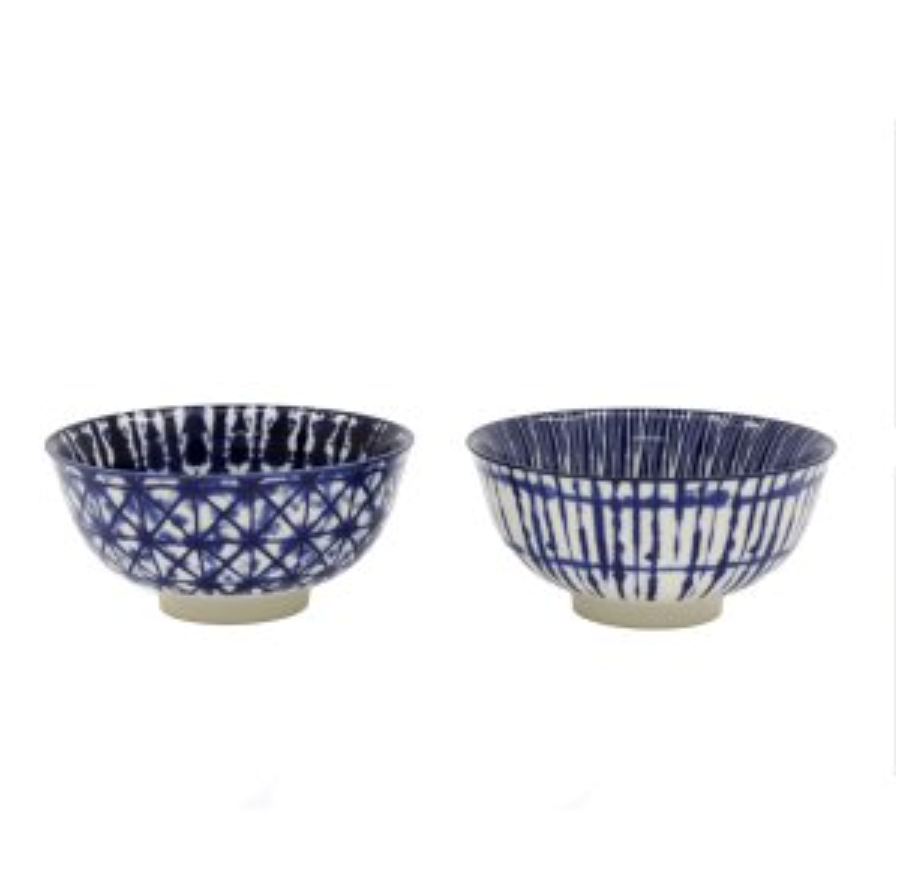 Two blue and white ceramic bowls on a white background