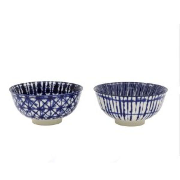 Two blue and white ceramic bowls on a white background