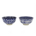 Two blue and white ceramic bowls on a white background