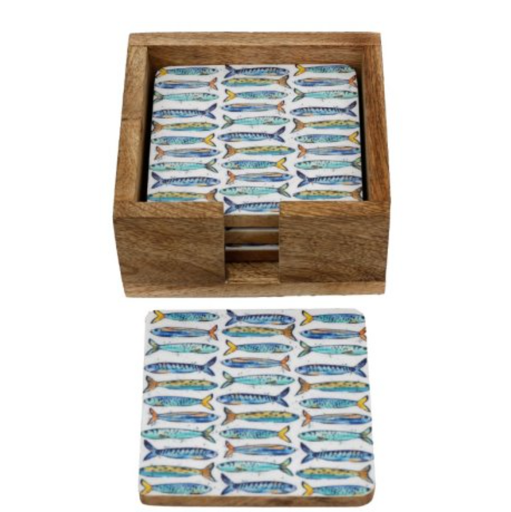 Set of coasters with fish pattern in a wooden box on a white background