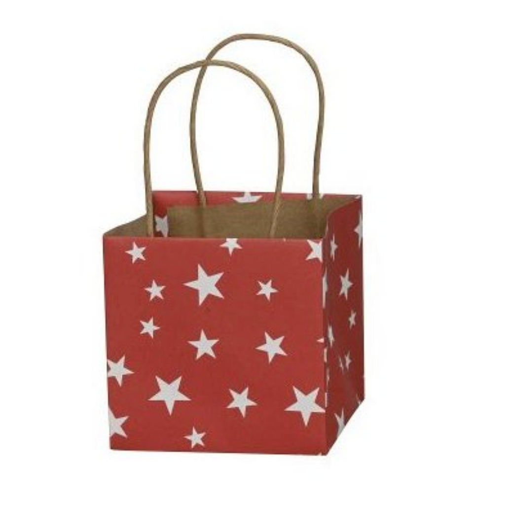 A small red paper gift bag with white star patterns and natural brown paper handles, shown on a plain white background.