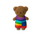 A crocheted teddy bear toy wearing a rainbow-striped shirt and shorts, centered on a plain white background.