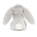 A light gray plush bunny toy shown from the back, featuring long floppy ears, a soft gray body, and a contrasting white fluffy tail, photographed on a seamless white background.