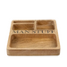 A rectangular wooden compartment tray engraved with the words 'MAN STUFF' in black lettering.