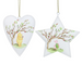 Two white hanging ornaments shaped like a heart and a star, each printed with a tree illustration and a small character scene, suspended by thin gold strings on a plain white background.