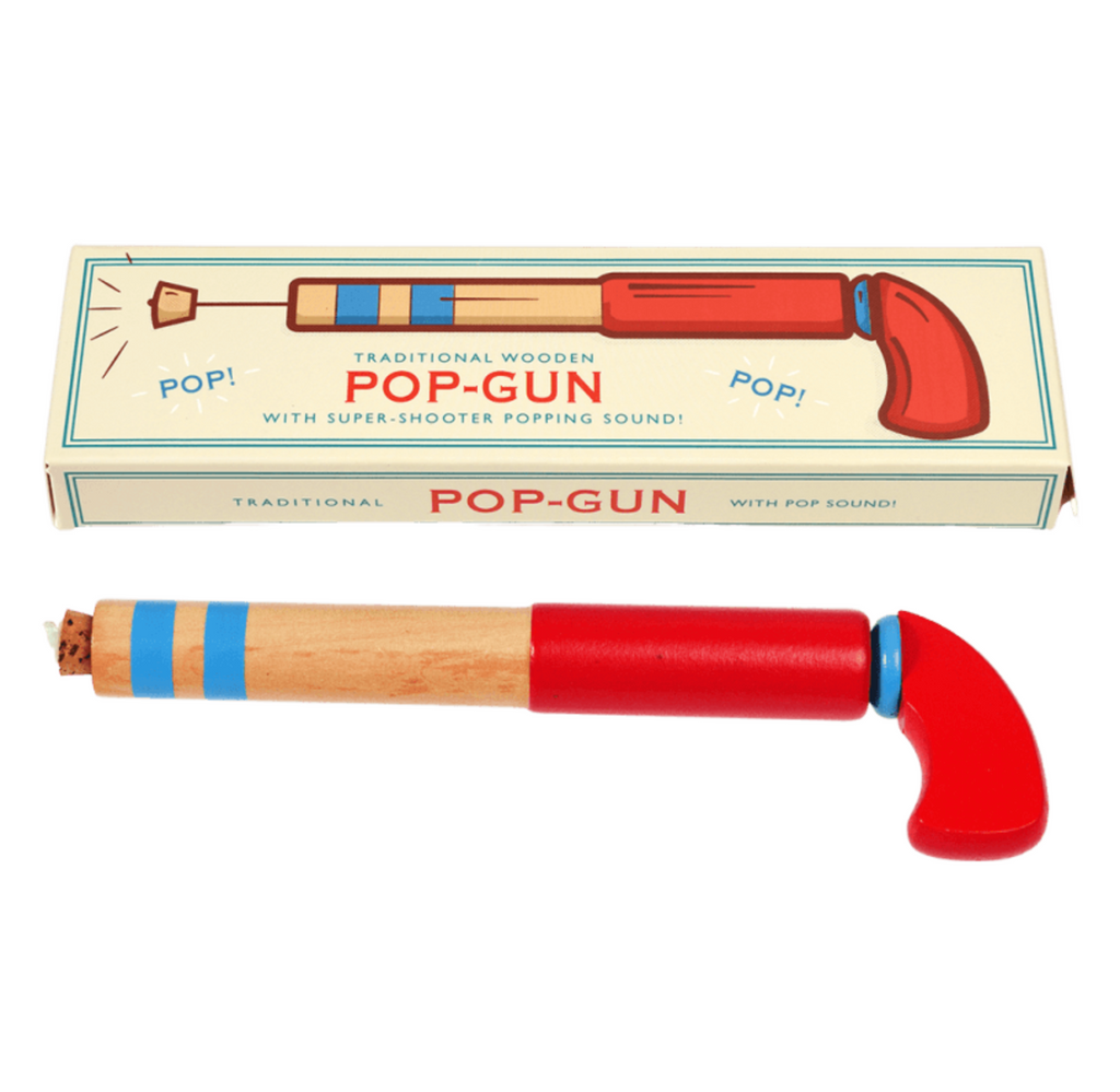A traditional wooden toy pop-gun set shown with its vintage illustrated box on a plain white background. The toy consists of a light wood body with blue painted stripes, a bright red barrel, and a red curved muzzle, with a cork plug visible at one end.