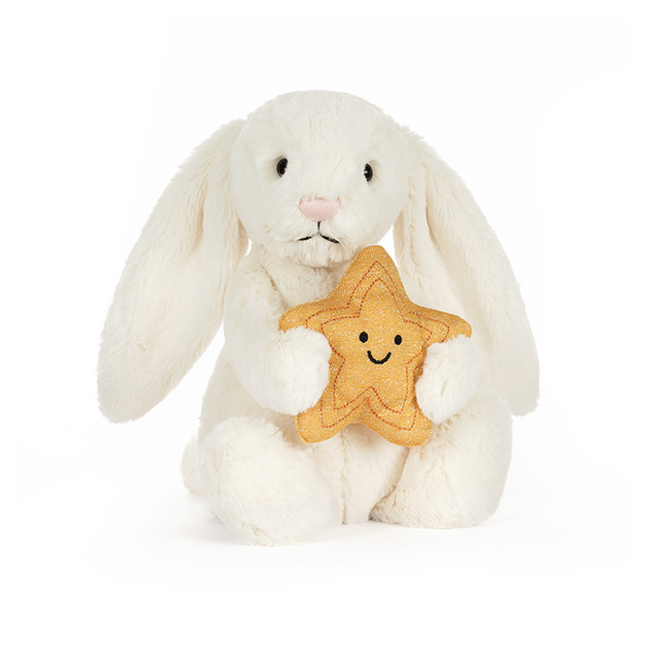 White plush bunny holding a star-shape on a white background