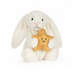 White plush bunny holding a star-shape on a white background
