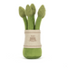 Set of green asparagus-shapes  in a fabric holder on a white background